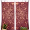 Indian curtain in gold with Fatima's hand in dark red